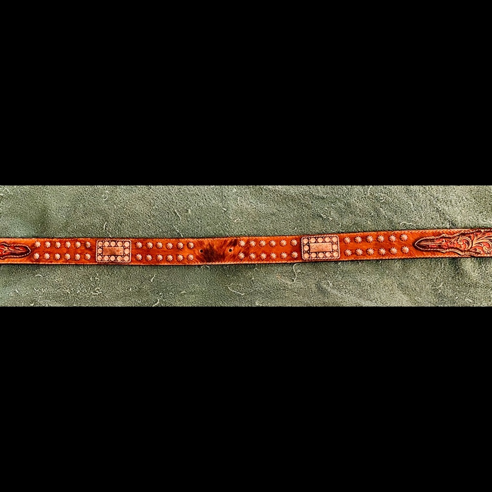 Leather tooled western belt with cowhide